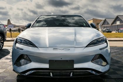 A silver sports car parked in a parking lot